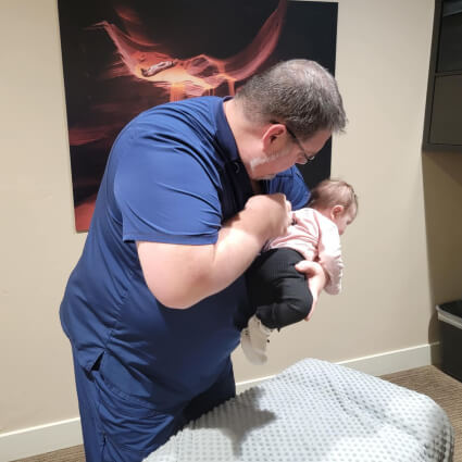Doctor adjusting baby