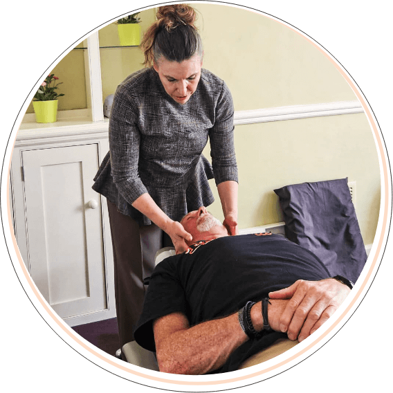 Chiropractor massaging patient