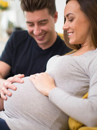 Pregnant couple relaxing