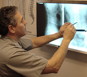 Dr. Karas reviewing x-rays