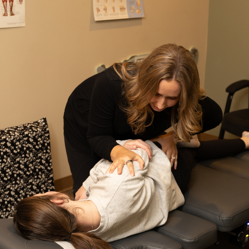 chiropractor adjusting kid's back