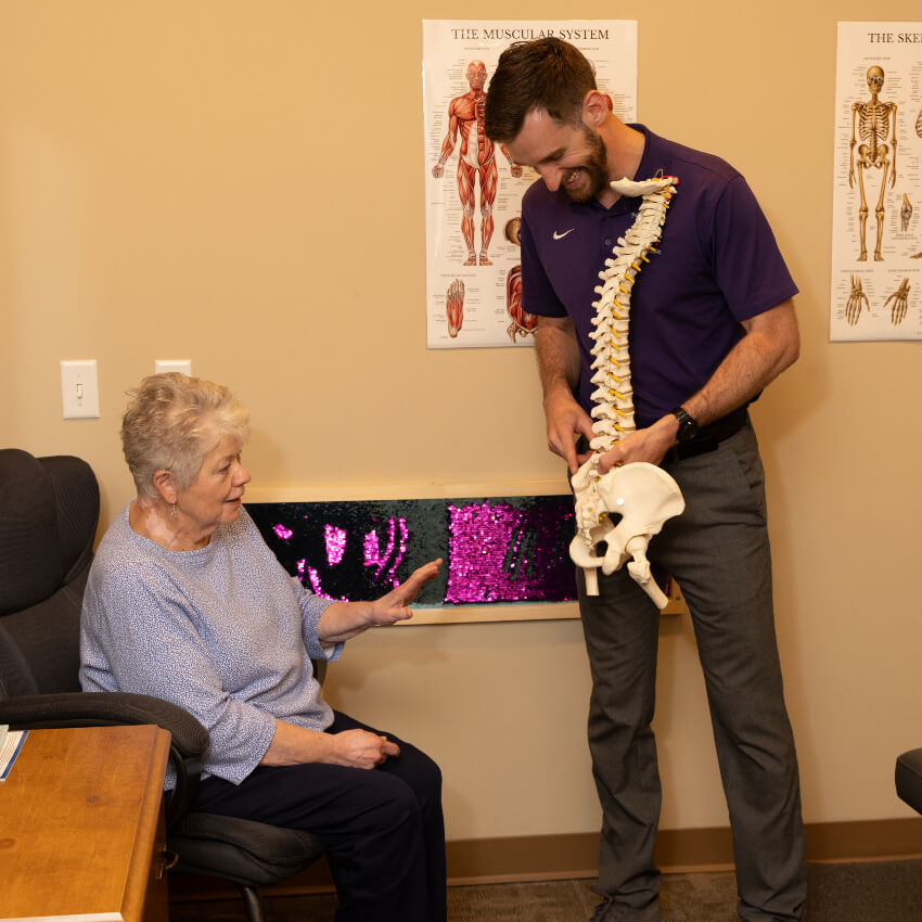 chiropractor talking with a patient