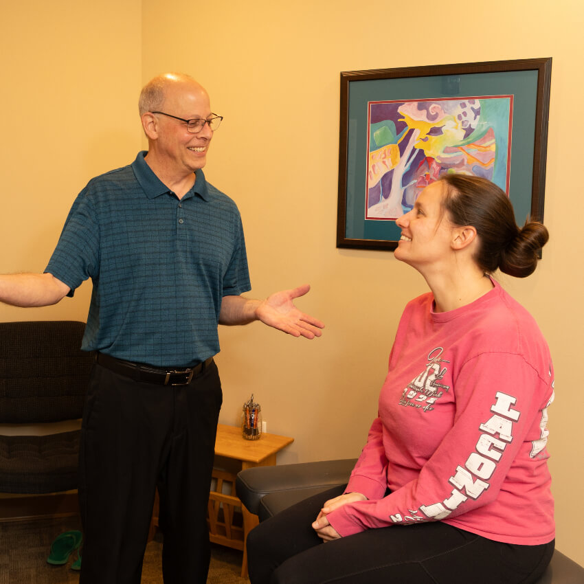 chiropractor smiling at patient
