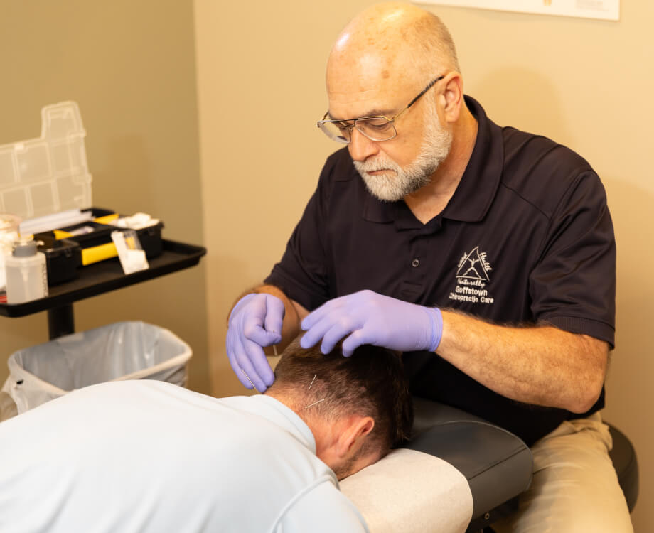 Doctor applying acupuncture