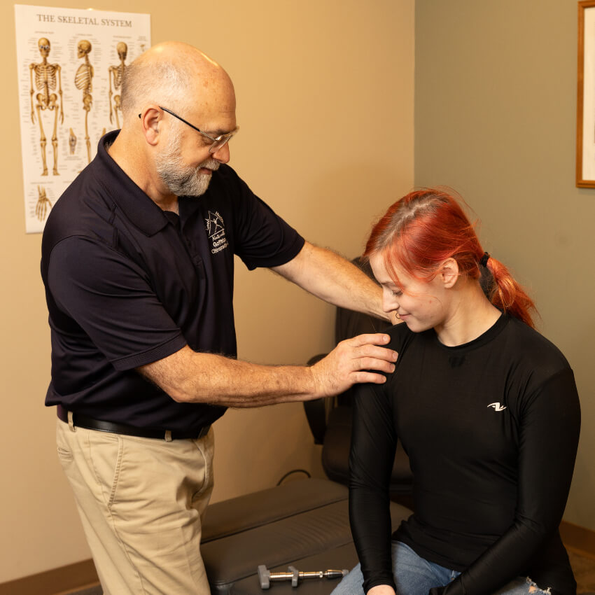 Goffstown Chiropractic Care, PLLC patient having shoulder adjusted
