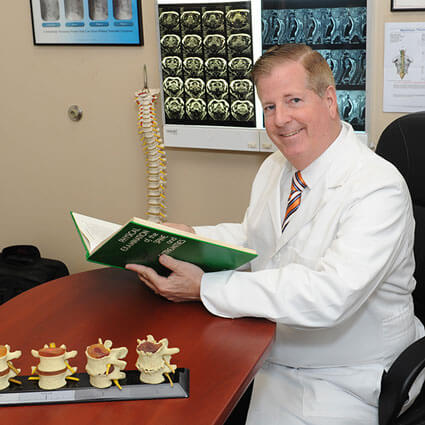 Dr. Adolph at his desk