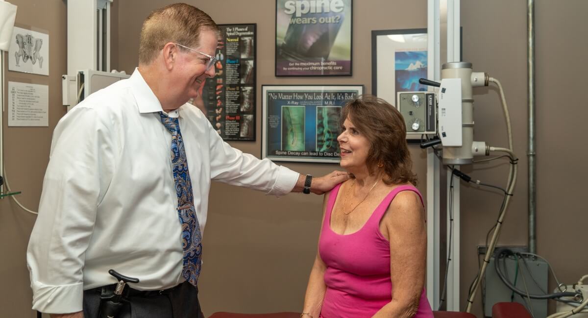 Timonium chiropractor in consultation with patient