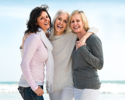 Happy women standing and smiling