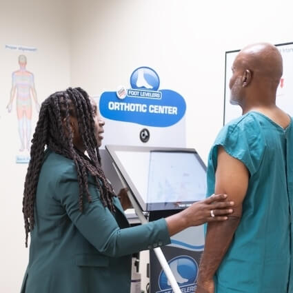 Dr Levi talking with patient during a scan