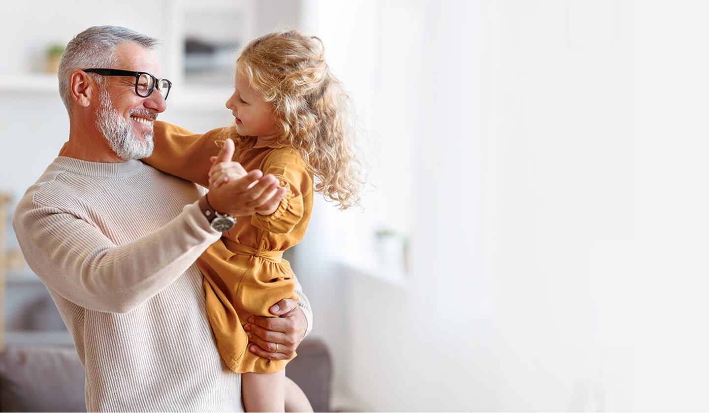 Grandpa dancing with his granddaughter