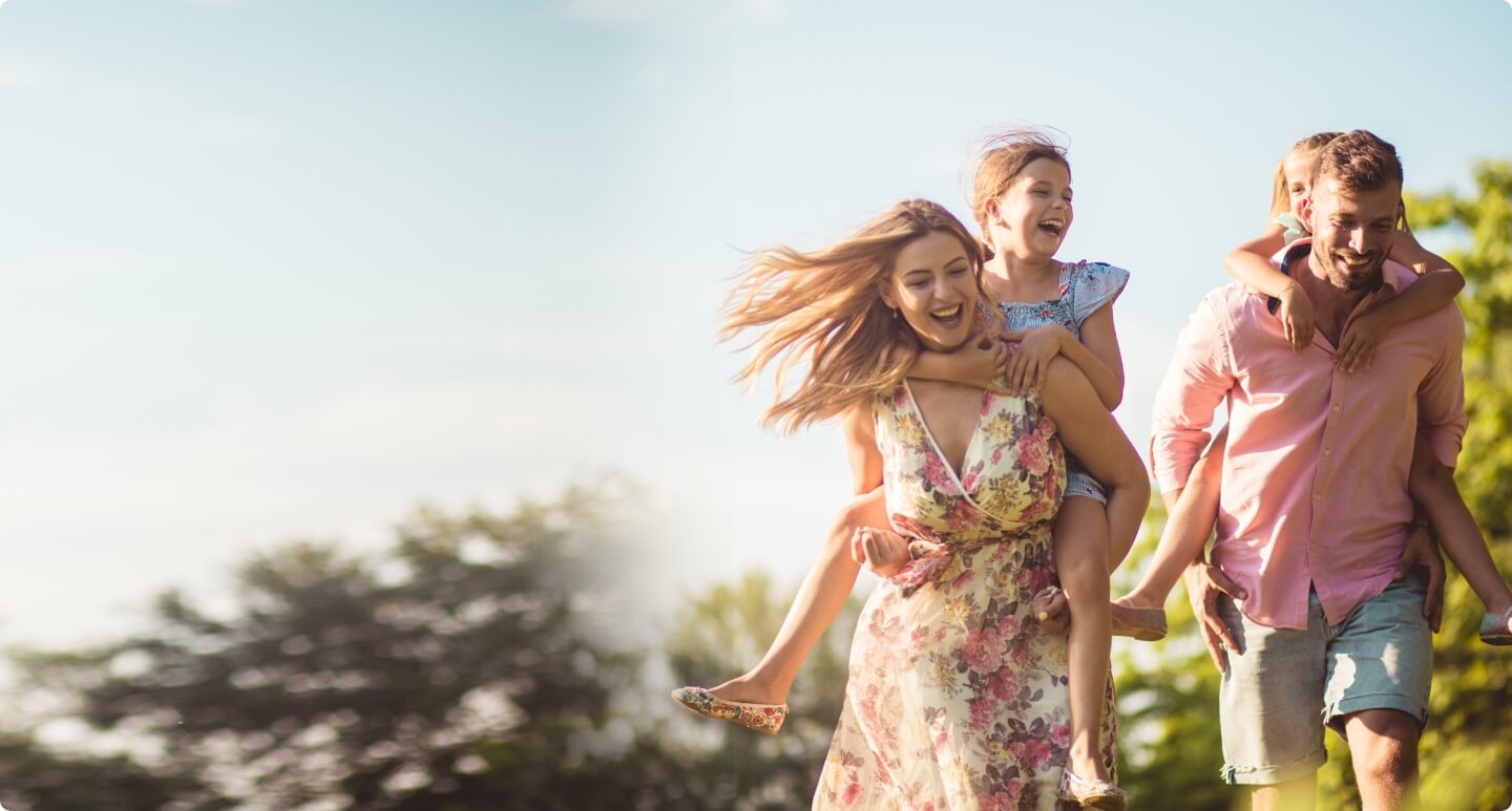 Mom and dad carrying their kids on their backs
