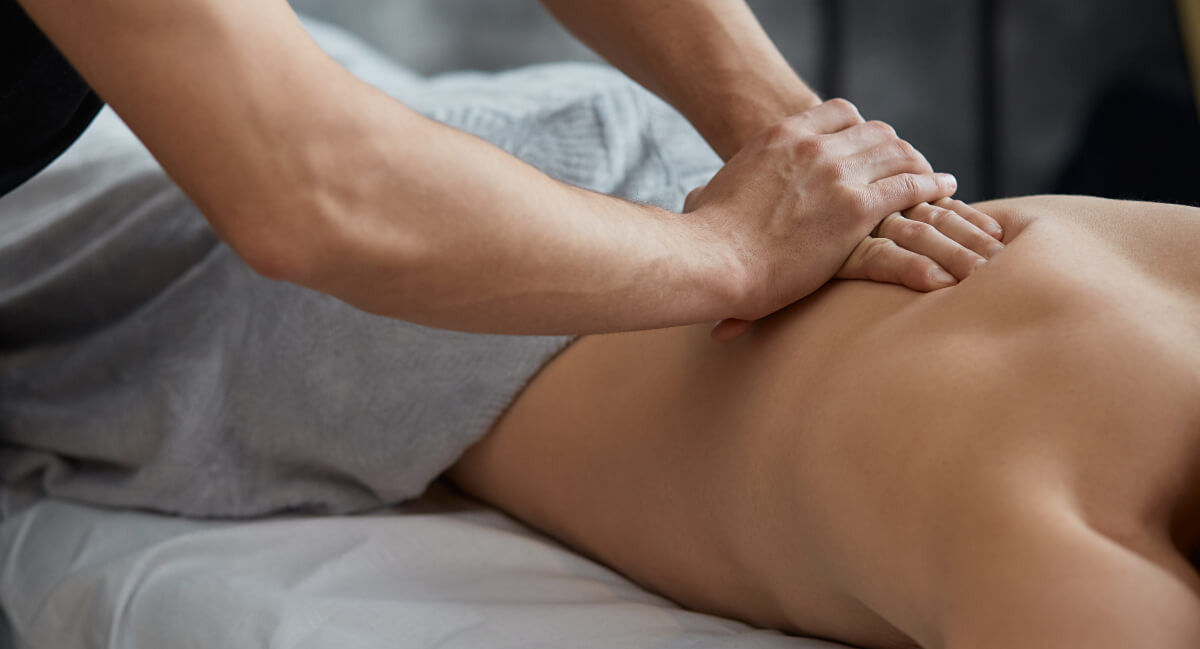 Male patient being treated with massage therapy