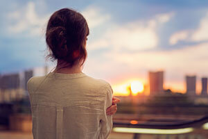 woman looking out window