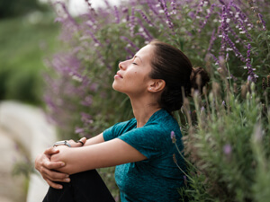 woman relaxing in a garden