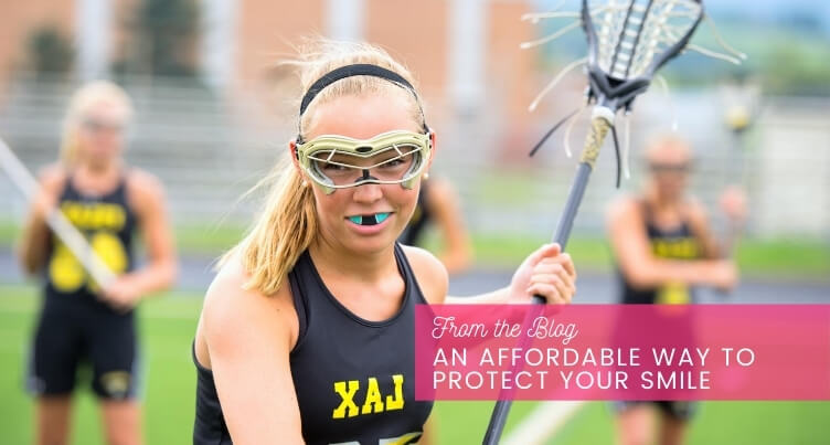 Girl playing lacrosse.