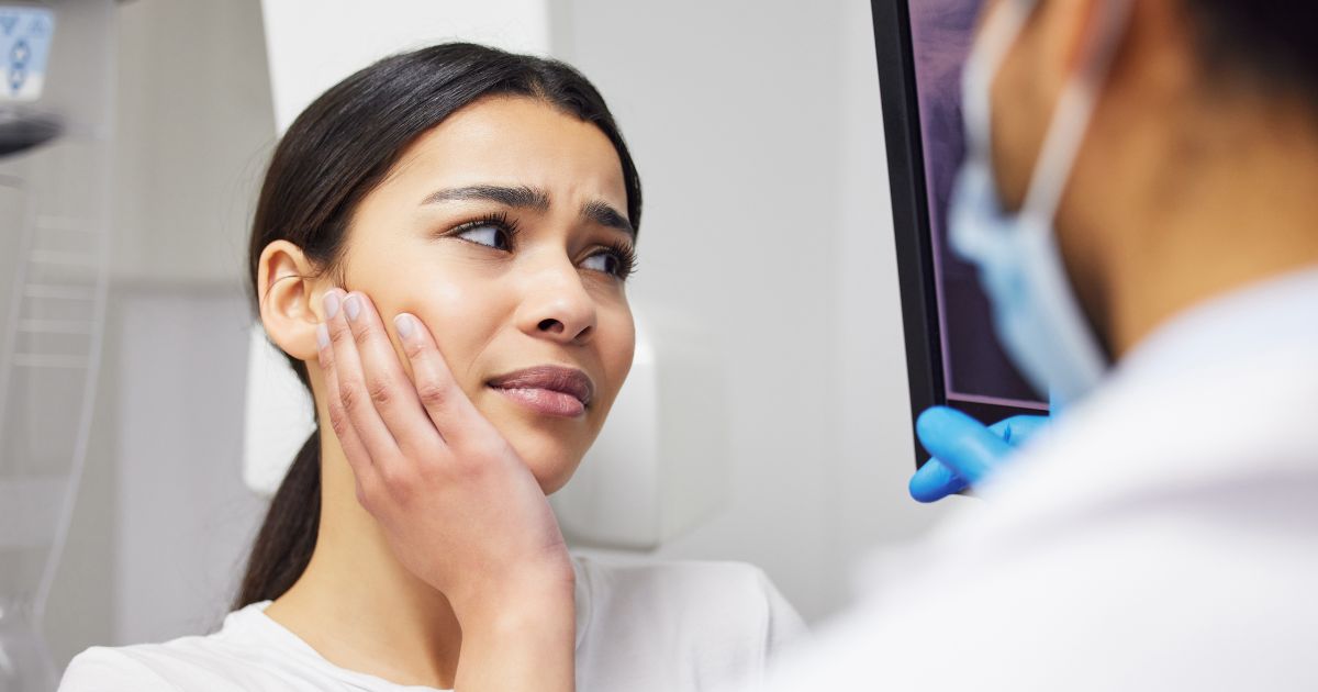 Nervous patient in dental chair.