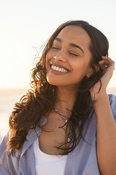 Woman happy and smiling on beach