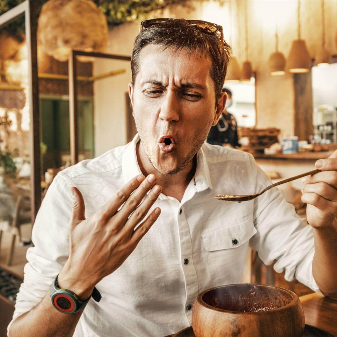 Man eating spicy food.