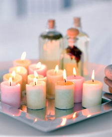 Lit aromatherapy candles on tray