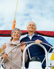 Couple steering a sailboat