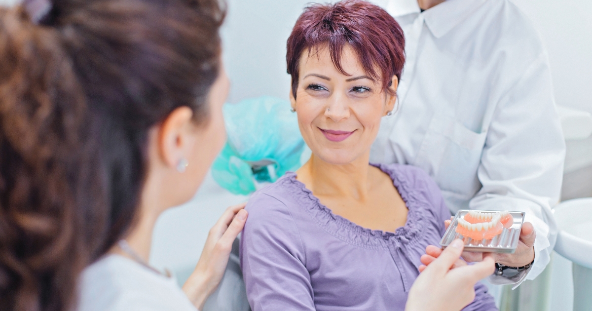 Woman smiling in a dental practice.