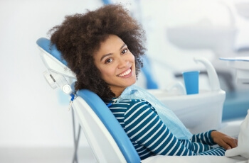 Woman in dental chair.