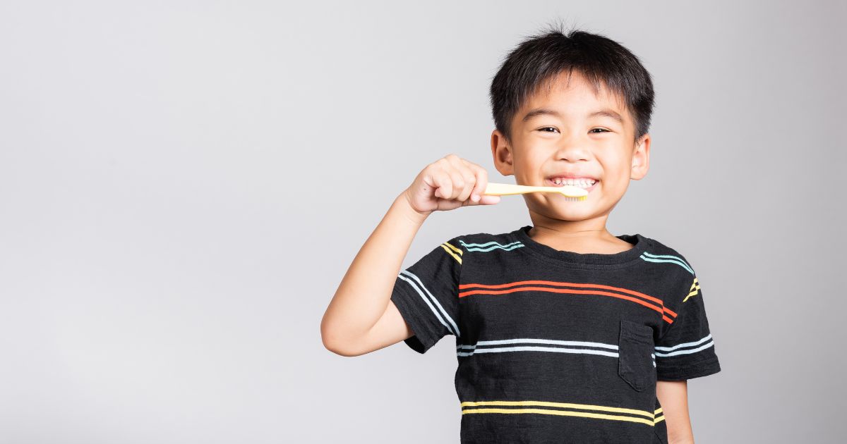 Child brushing his teeth.