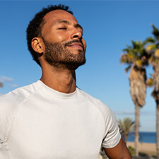 smiling man taking in fresh outdoors air