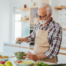 man preparing a salad