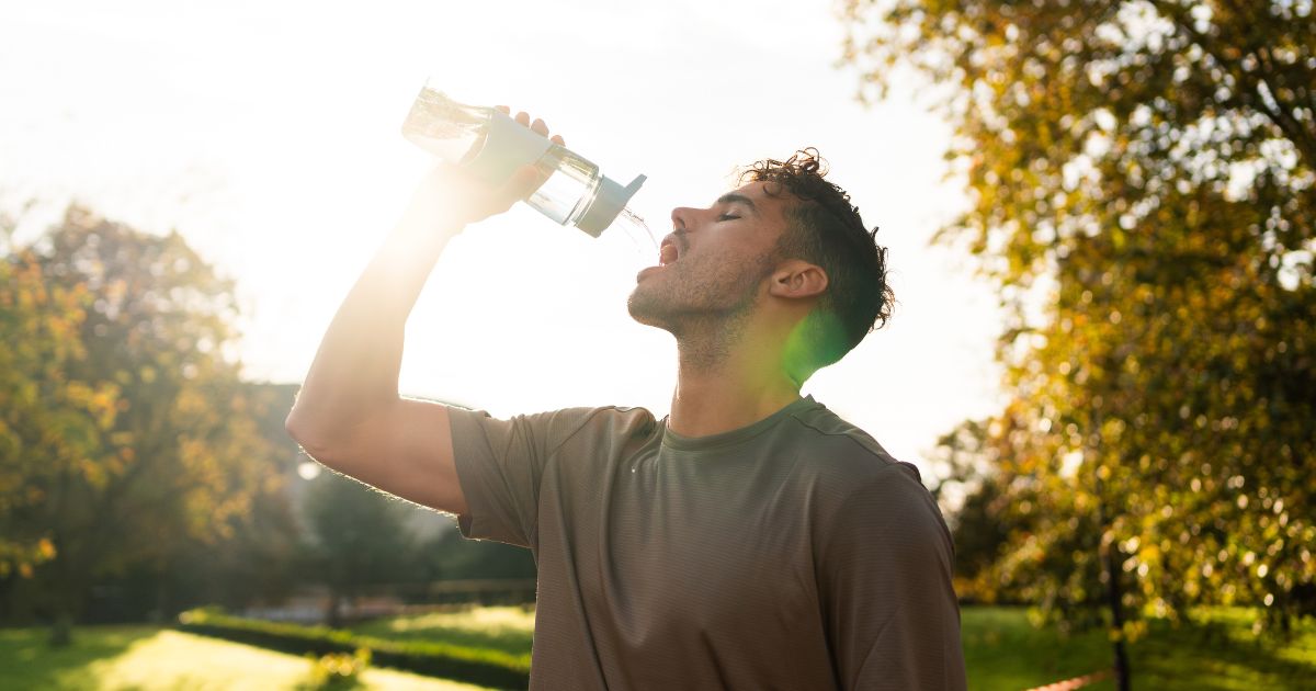 Man drinking water.