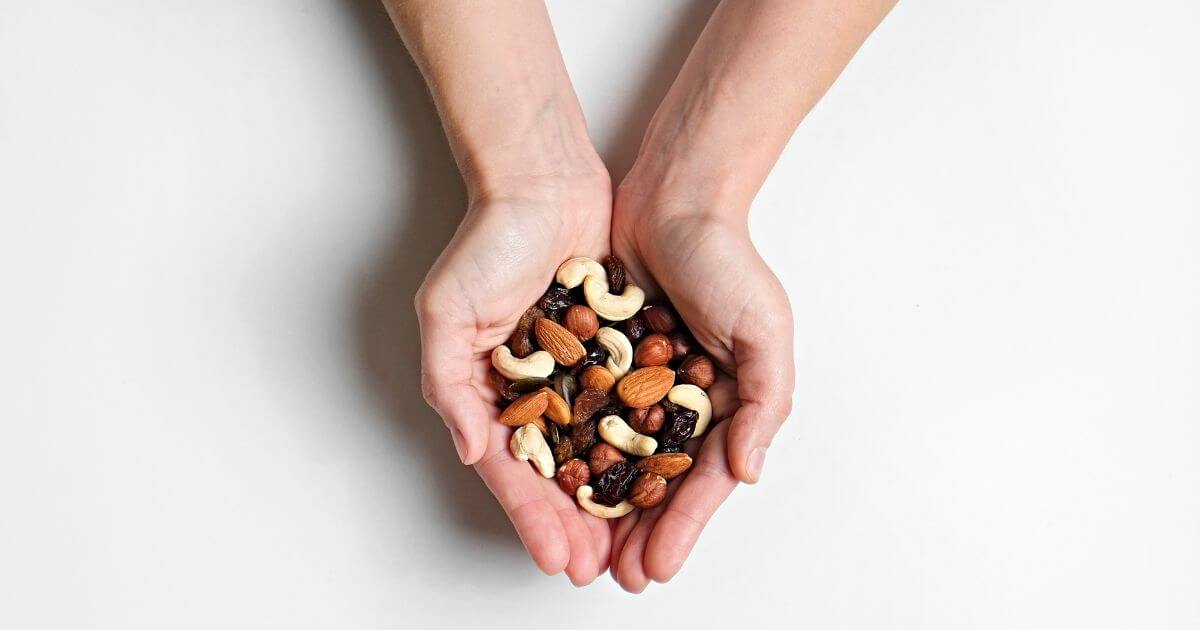 Hands full of nuts.