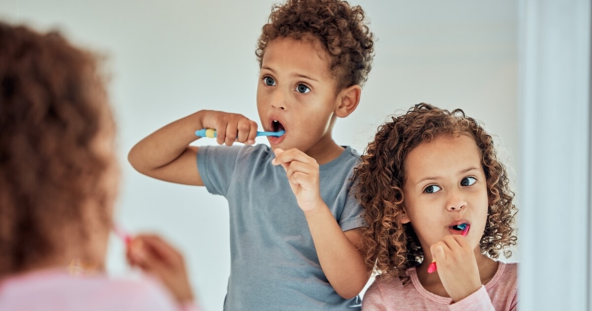 Children brushing their teeth.