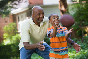 senior man playing with grandson