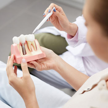 dentist explaining tooth implants