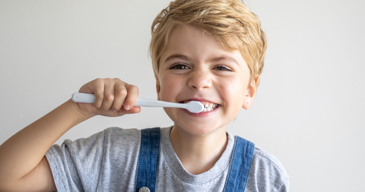 Child brushing teeth.