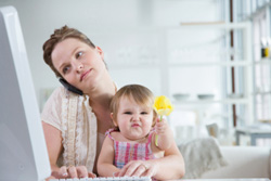 woman and child sitting at the computer