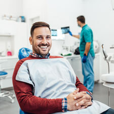 Happy man at dental visit