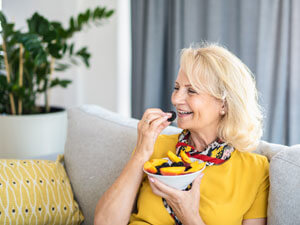 Woman eating fruit