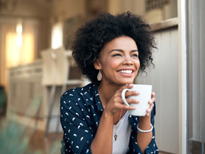 Happy woman holding mug