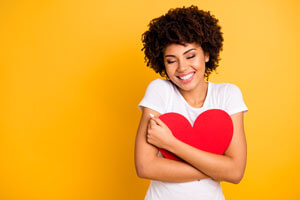 Woman hugging heart