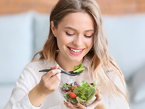 woman eating a salad