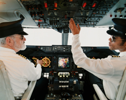 Two pilots in the cockpit of a plane