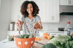 woman making salad