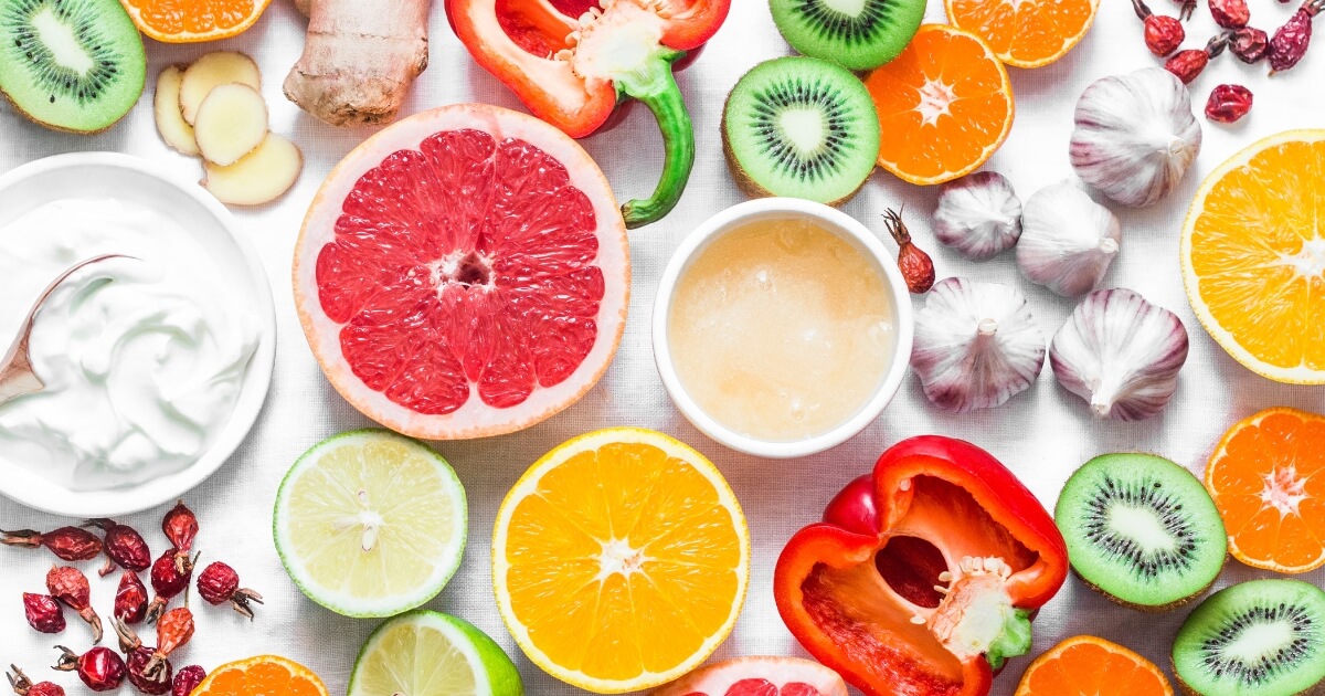 Acidic foods like orange and grapefruit cut in half.