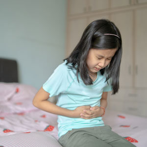 Girl with tummy pain