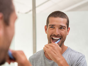 Man brushing teeth