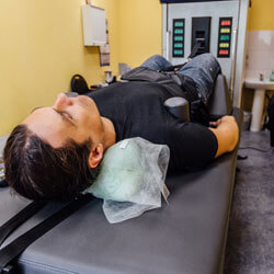 man in spinal decompression machine