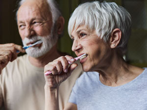 Couple brushing teeth