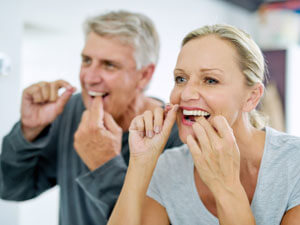 Older couple taking care of teeth