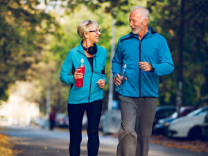 older couple walking outside